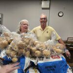 Mannahelp volunteers helping to sort produce before distibution to those struggling to feed.