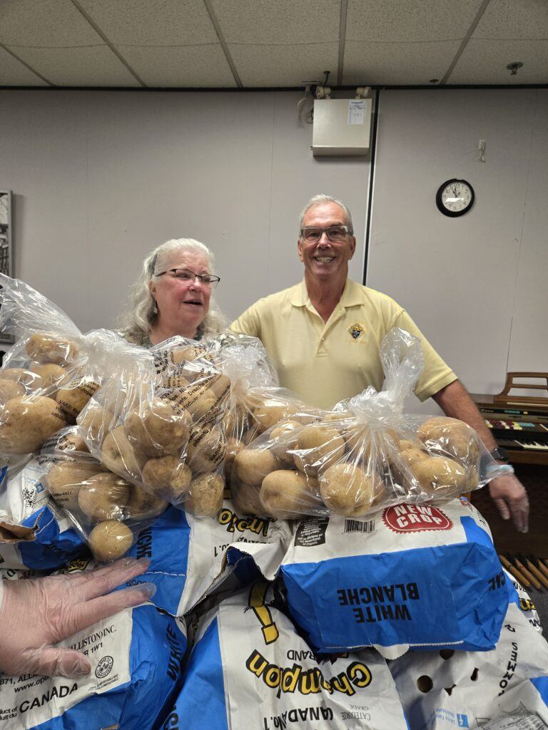 Mannahelp volunteers helping to sort produce before distibution to those struggling to feed.